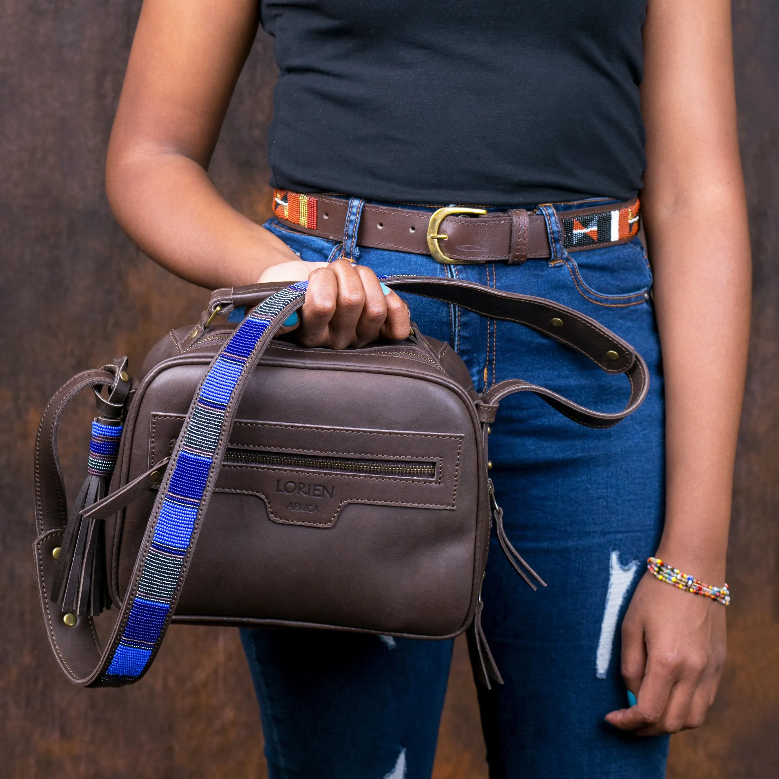 Leather sling bag with beaded strap