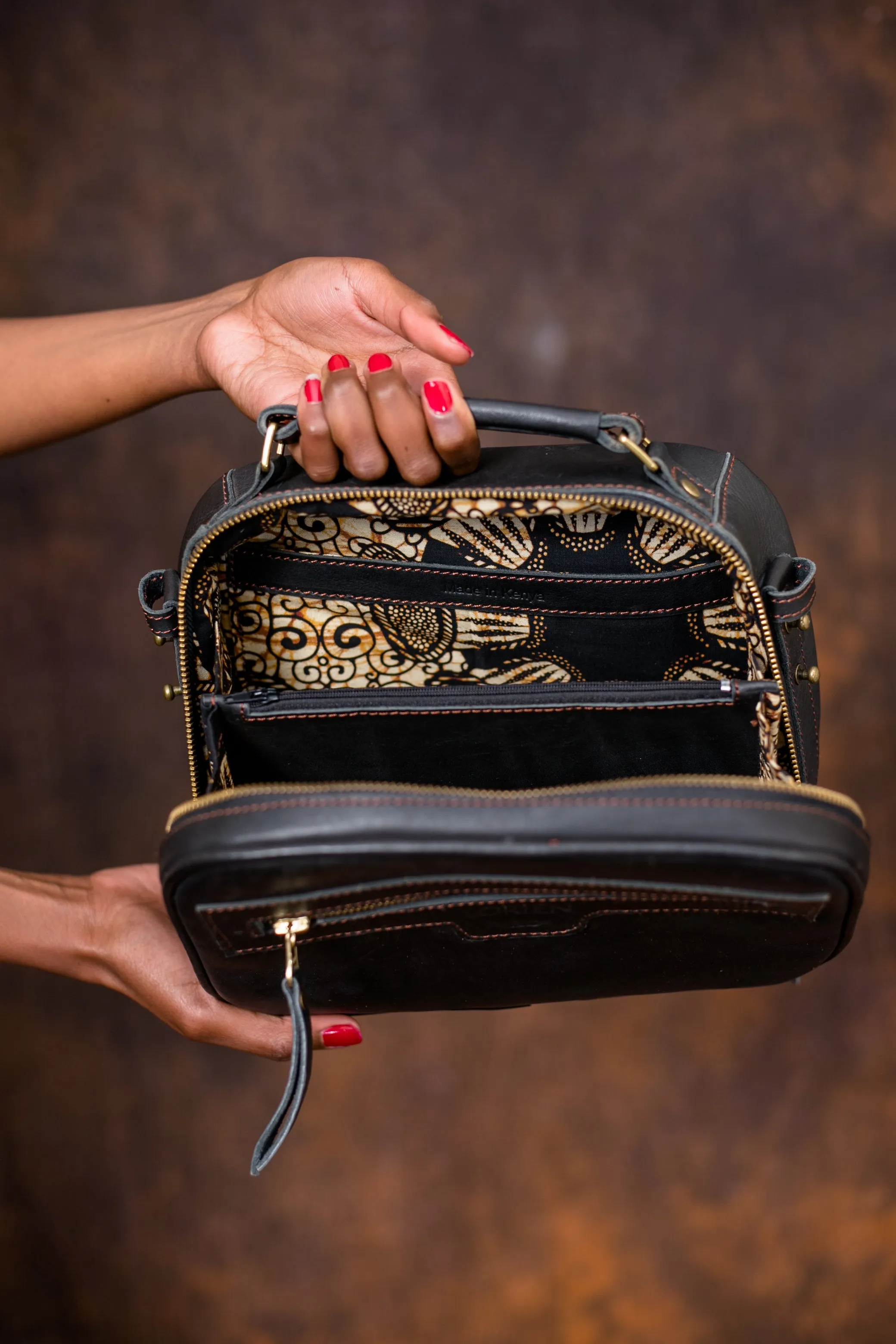 Leather sling bag with beaded strap
