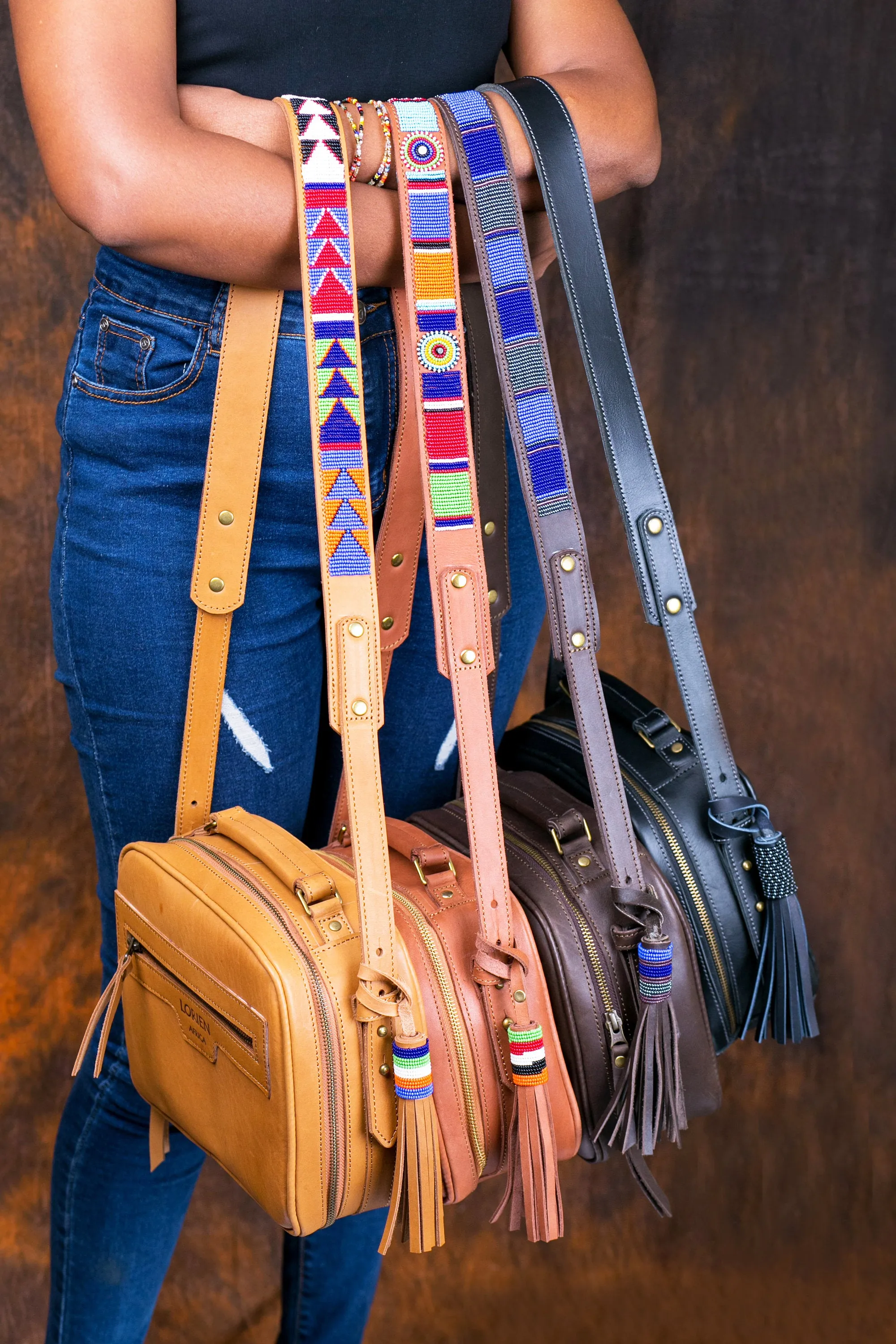Leather sling bag with beaded strap