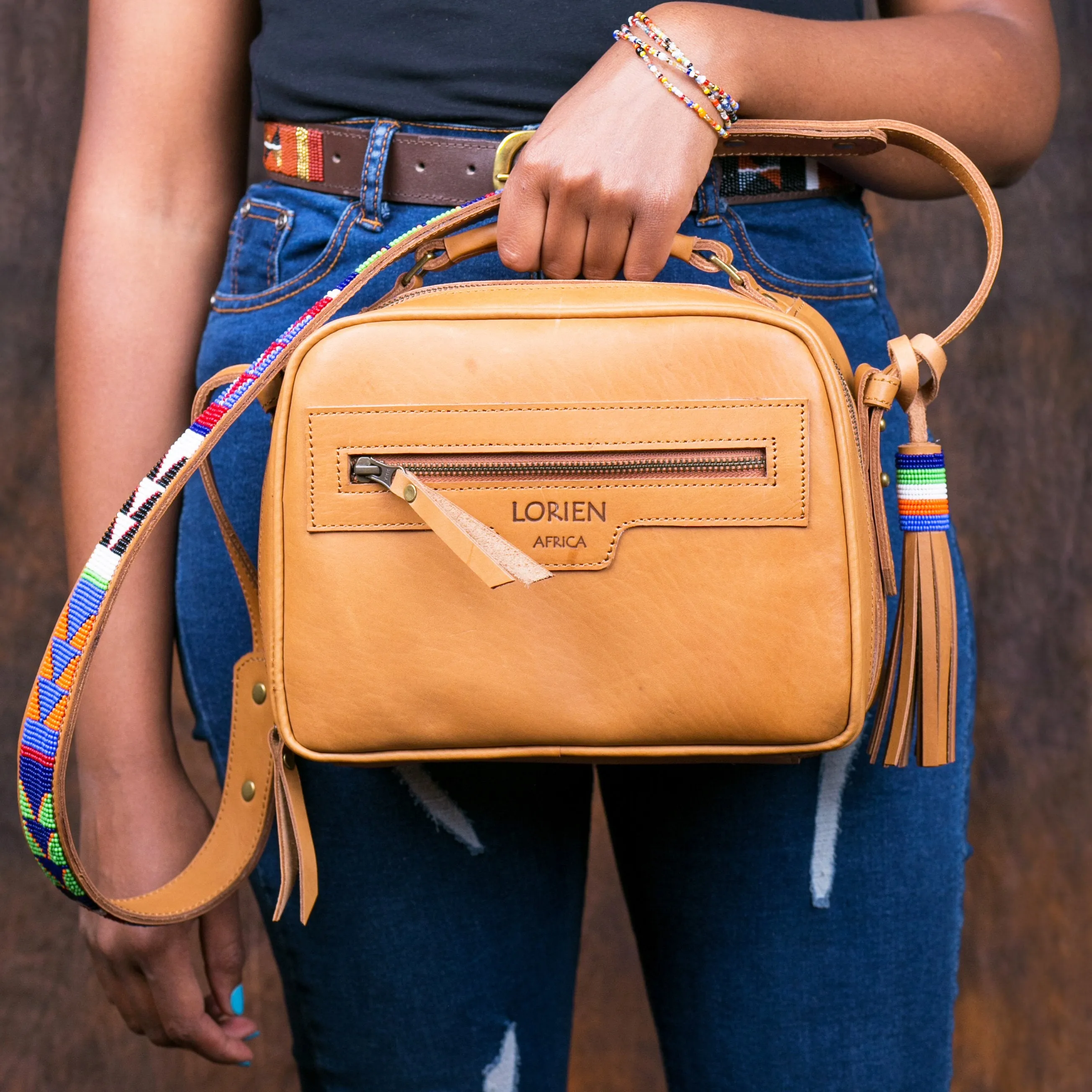 Leather sling bag with beaded strap